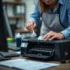 Technician refilling a printer cartridge with toner in an office setting, tools visible.
